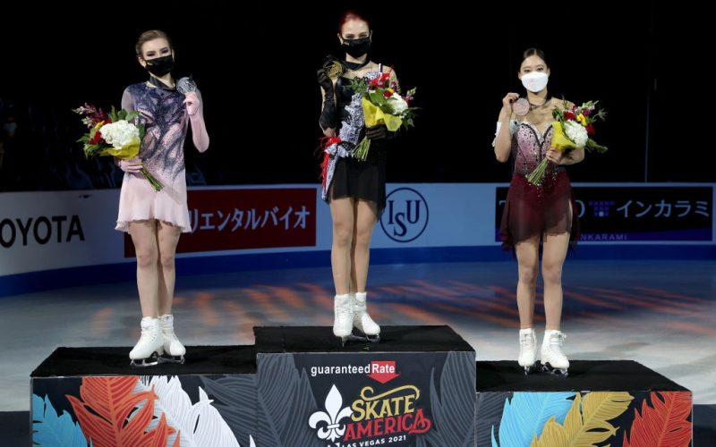 LAS VEGAS, NEVADA - OCTOBER 24: Daria Usacheva of Russia,     Alexandra Trusova of Russia and Young You of South Korea pose on the medal podium after skating in the Women's Competition during the ISU Grand Prix of Figure Skating - Skate America at Orleans Arena on October 24, 2021 in Las Vegas, Nevada. (Photo by Matthew Stockman - International Skating Union/International Skating Union via Getty Images)