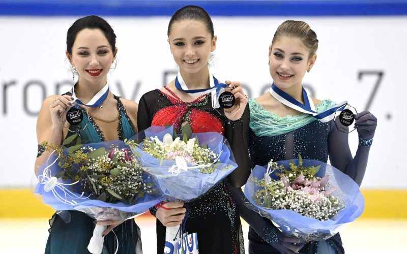 (LtoR) Second placed Russia's Elizaveta Tuktamysheva, winner Russia's Kamila Valieva and third placed Russia's Alena Kostornaia celebrate on the podium during the medal ceremony of the women's free skating of the Finlandia Trophy Espoo International Figure Skating competition in Espoo, Finland, on October 10, 2021. (Photo by Heikki Saukkomaa / Lehtikuva / AFP) / Finland OUT